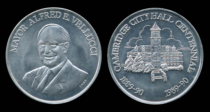 Being an admirer of sculptor Augustus Saint-Gaudens, who sculpted some of the most beautiful coins and medallions ever struck, I was overjoyed to be commissioned to design this coin, and presumptuous enough to fantasize that I was traipsing vaguely in the footsteps of Saint-Gaudens. (who spins in his grave like a lathe at the writing of this sentence.) The subjects were Mayor Alfred E. Vellucci of Cambridge, Massachusetts on one side and the Cambridge City Hall on the reverse. I was told that at the Cambridge City Hall Centennial parade, the mayor rode in an open limousine, flinging the coins (struck from the finest aluminum) to the citizens of Cambridge as a Caesar might to the masses.

The coolest thing about the coins is that they were manufactured by the same company that makes Mardi Gras "doubloons" in New Orleans.